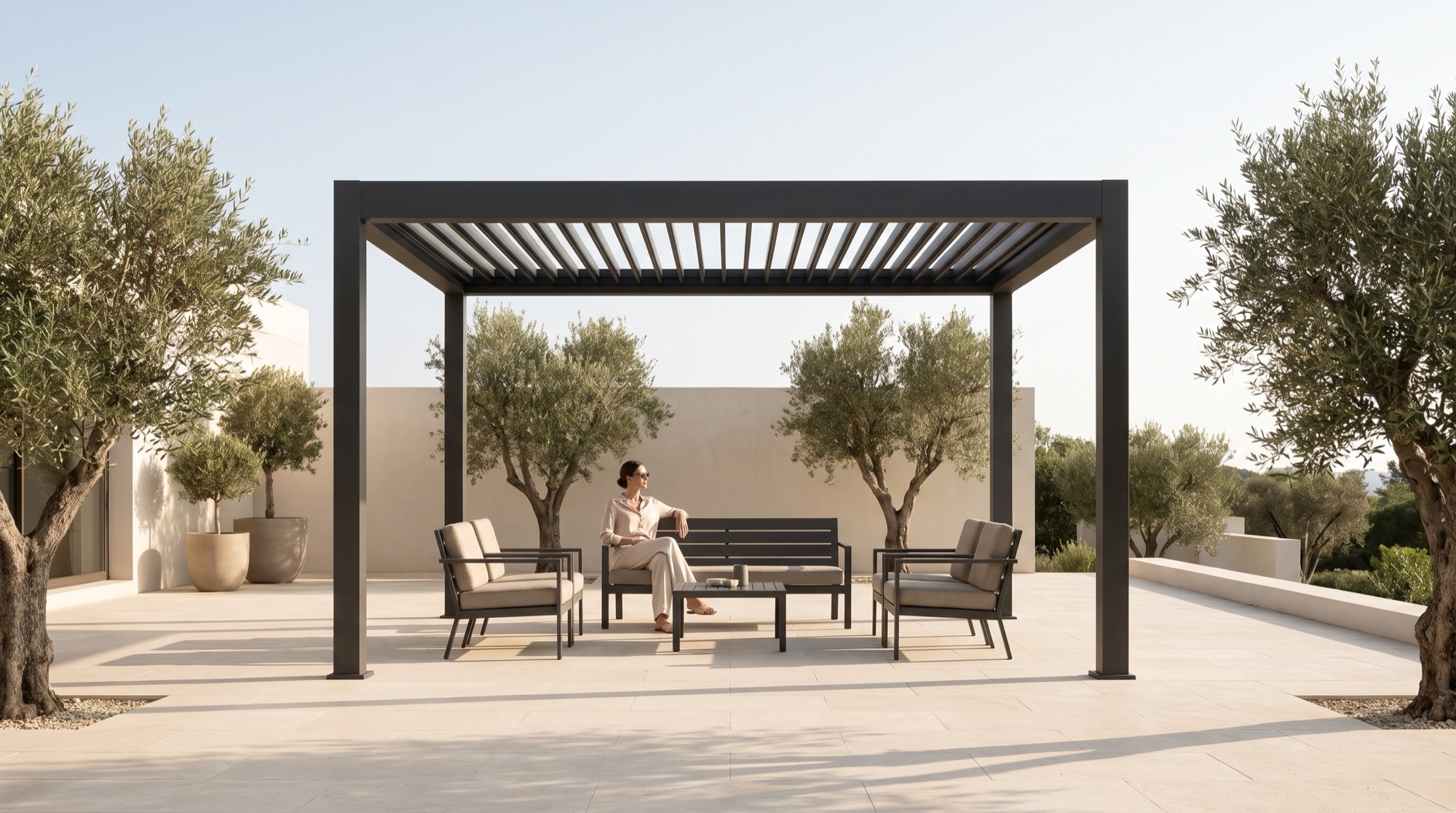 Dark aluminum louvered pergola in a garden